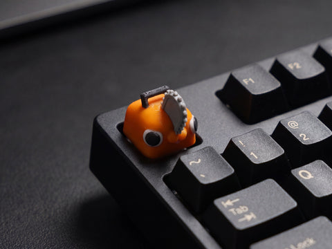 Pochita on black keyboard