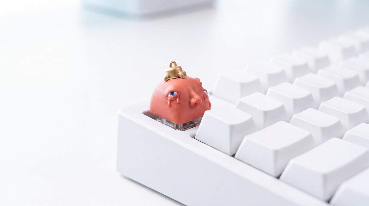Behelit en teclado blanco
