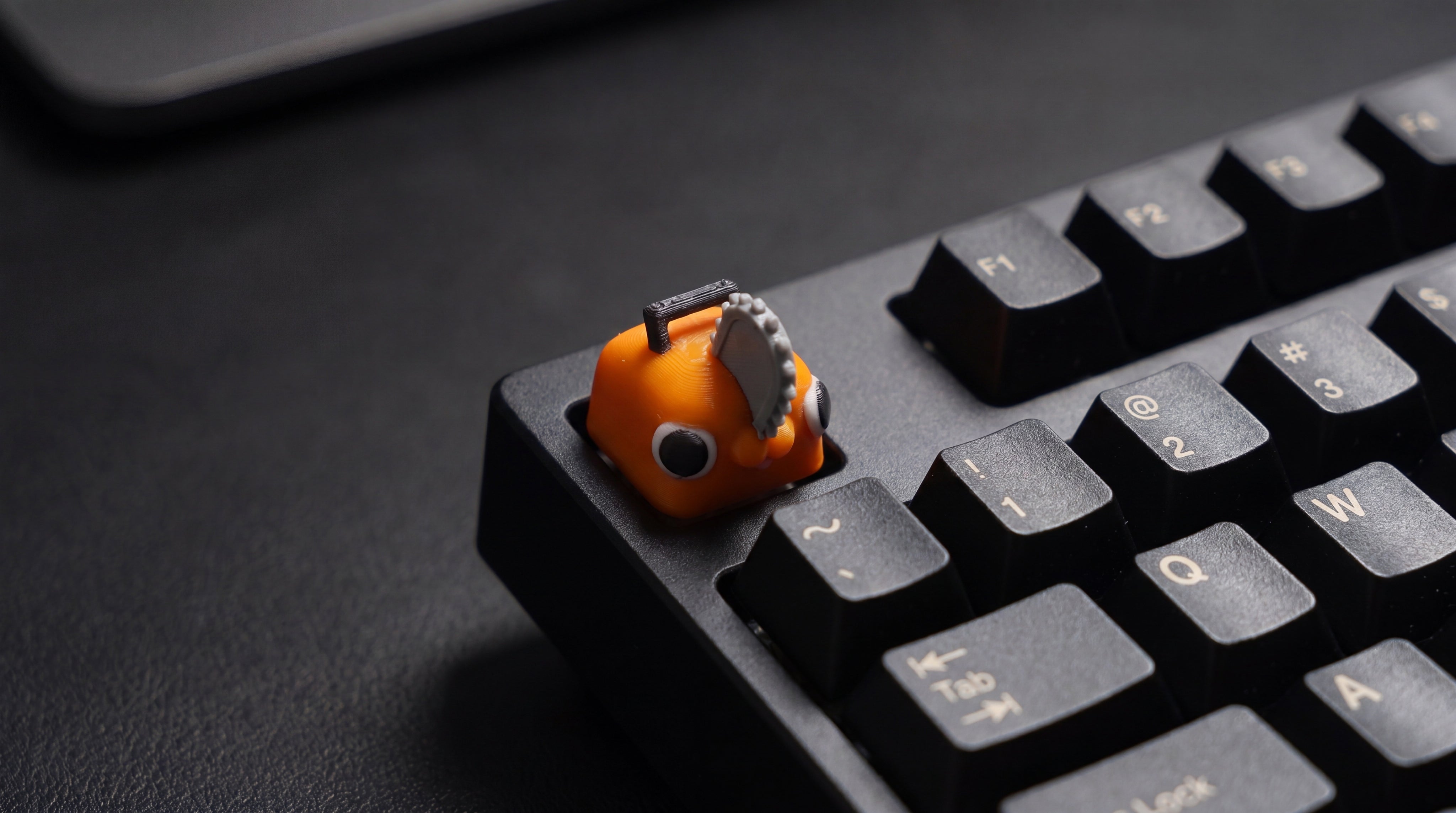 Pochita on black keyboard