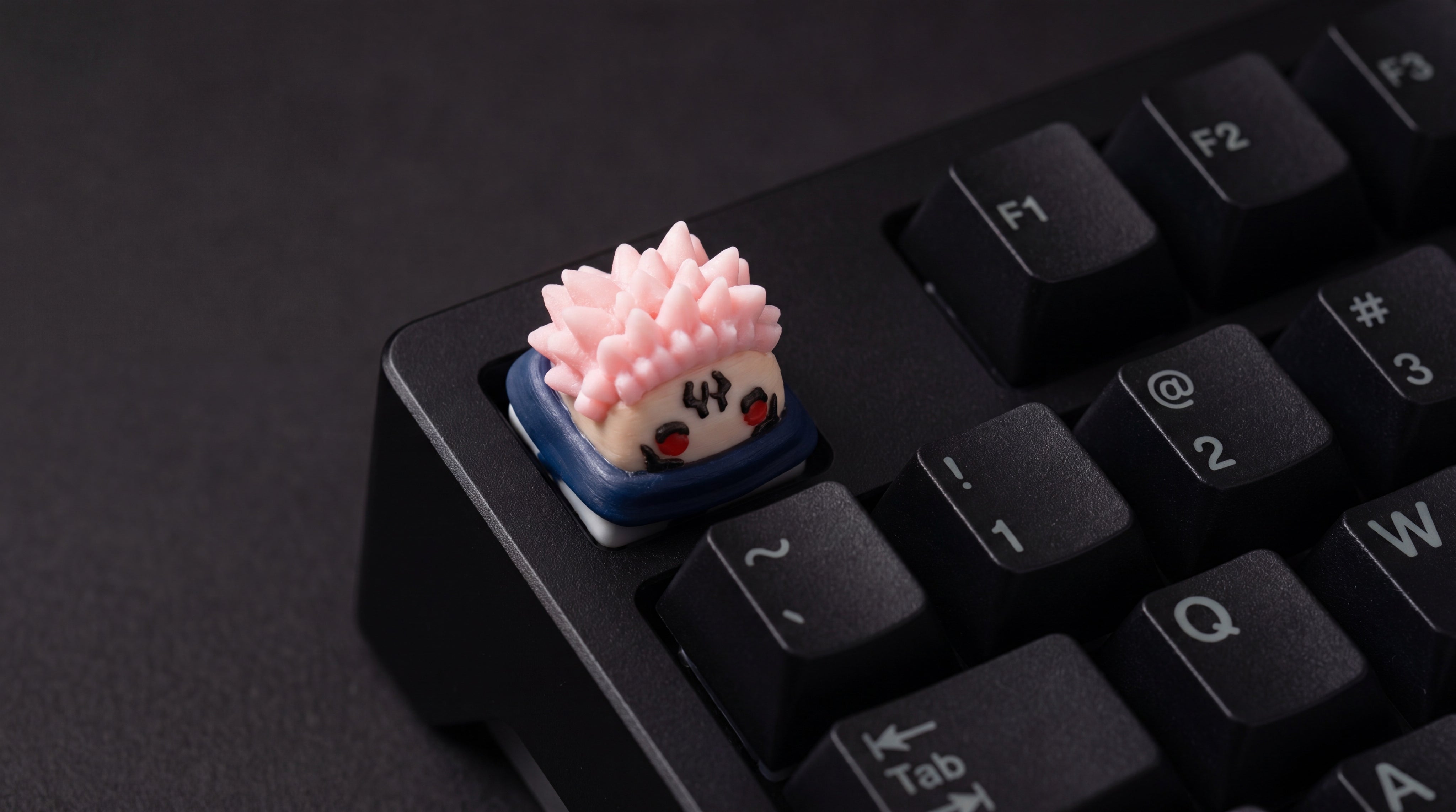 Sukuna on black keyboard