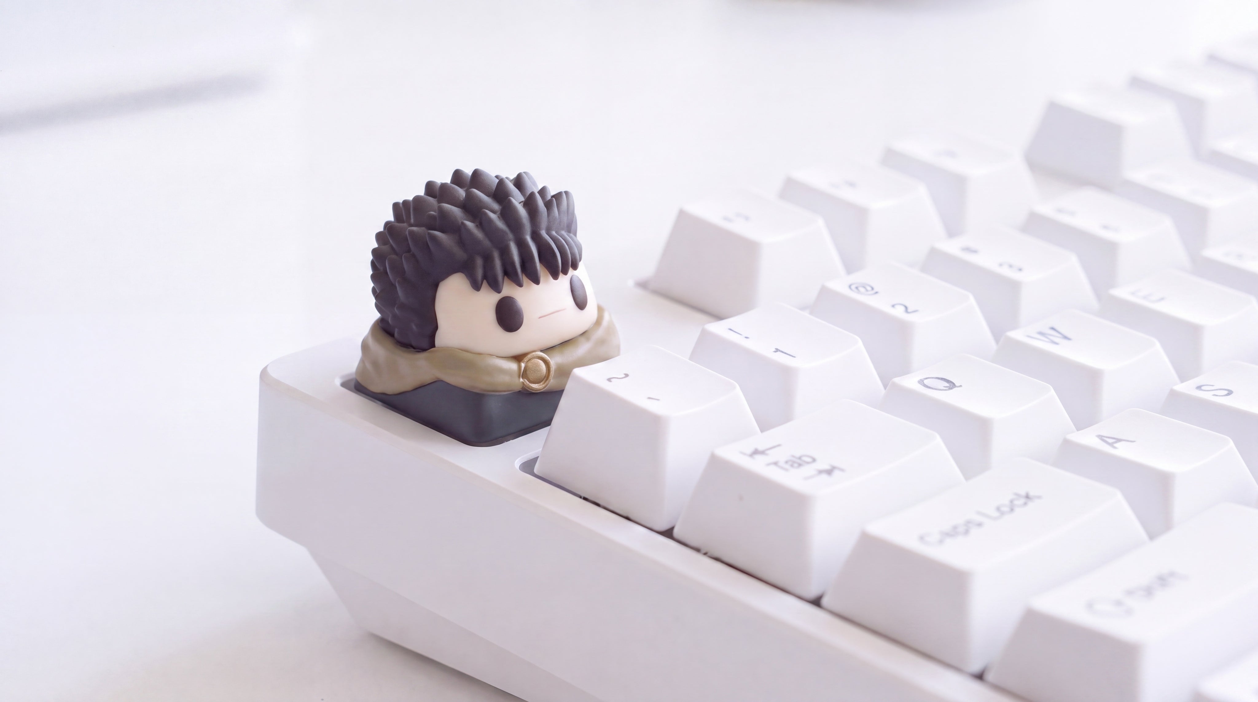 Guts Época Dorada en teclado blanco