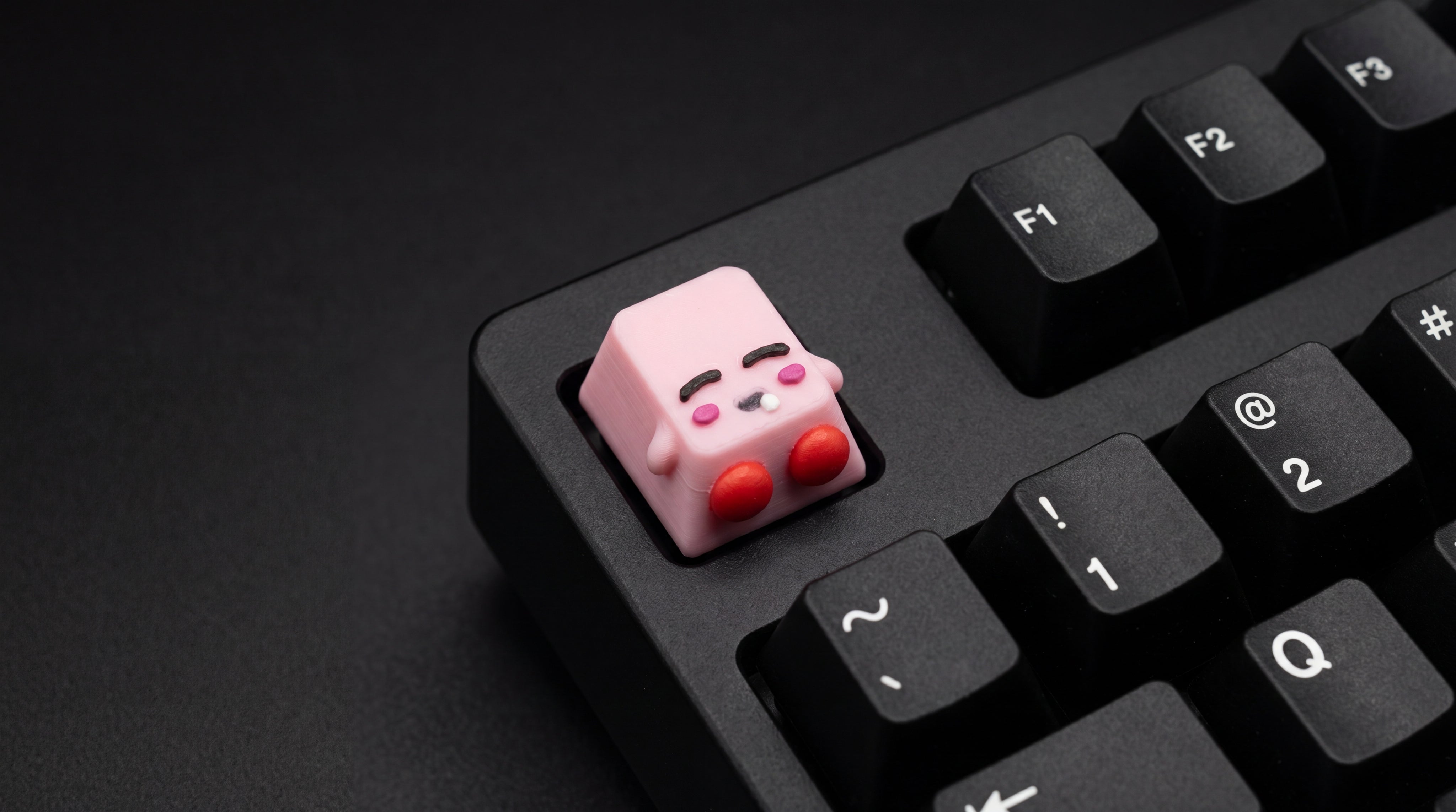 Kirby Sleep on black keyboard