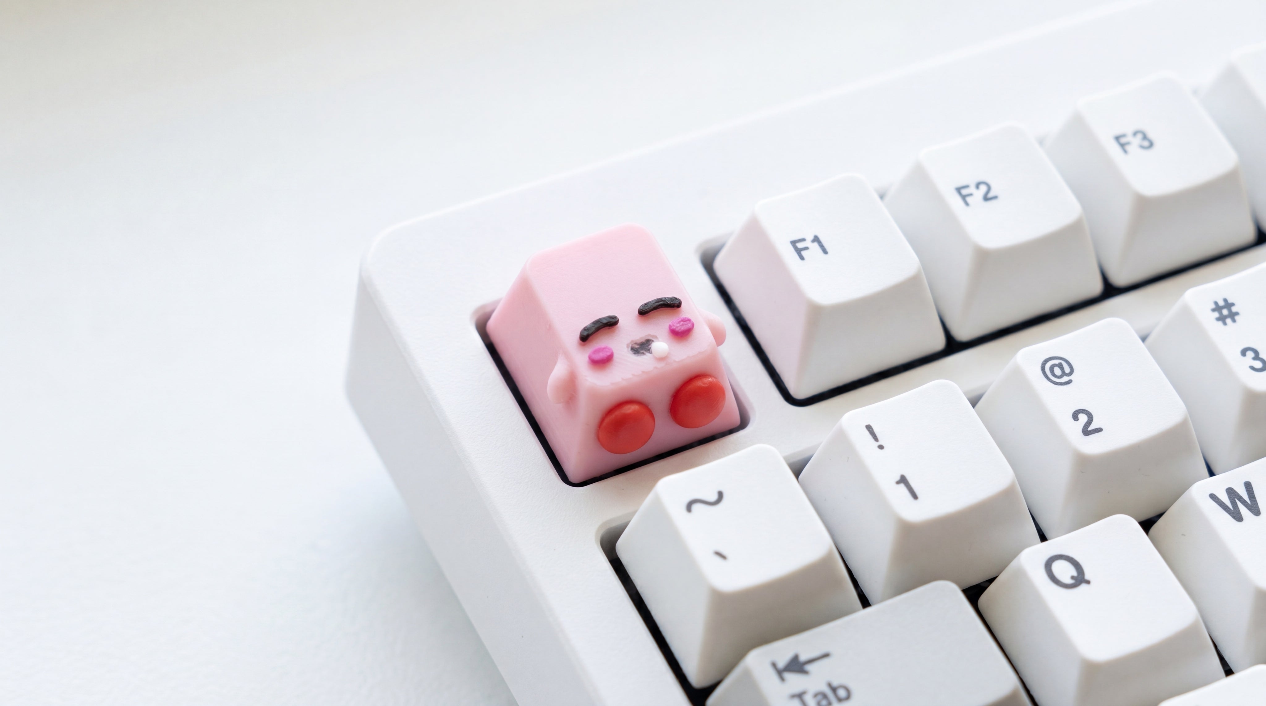 Kirby Sleep on white keyboard