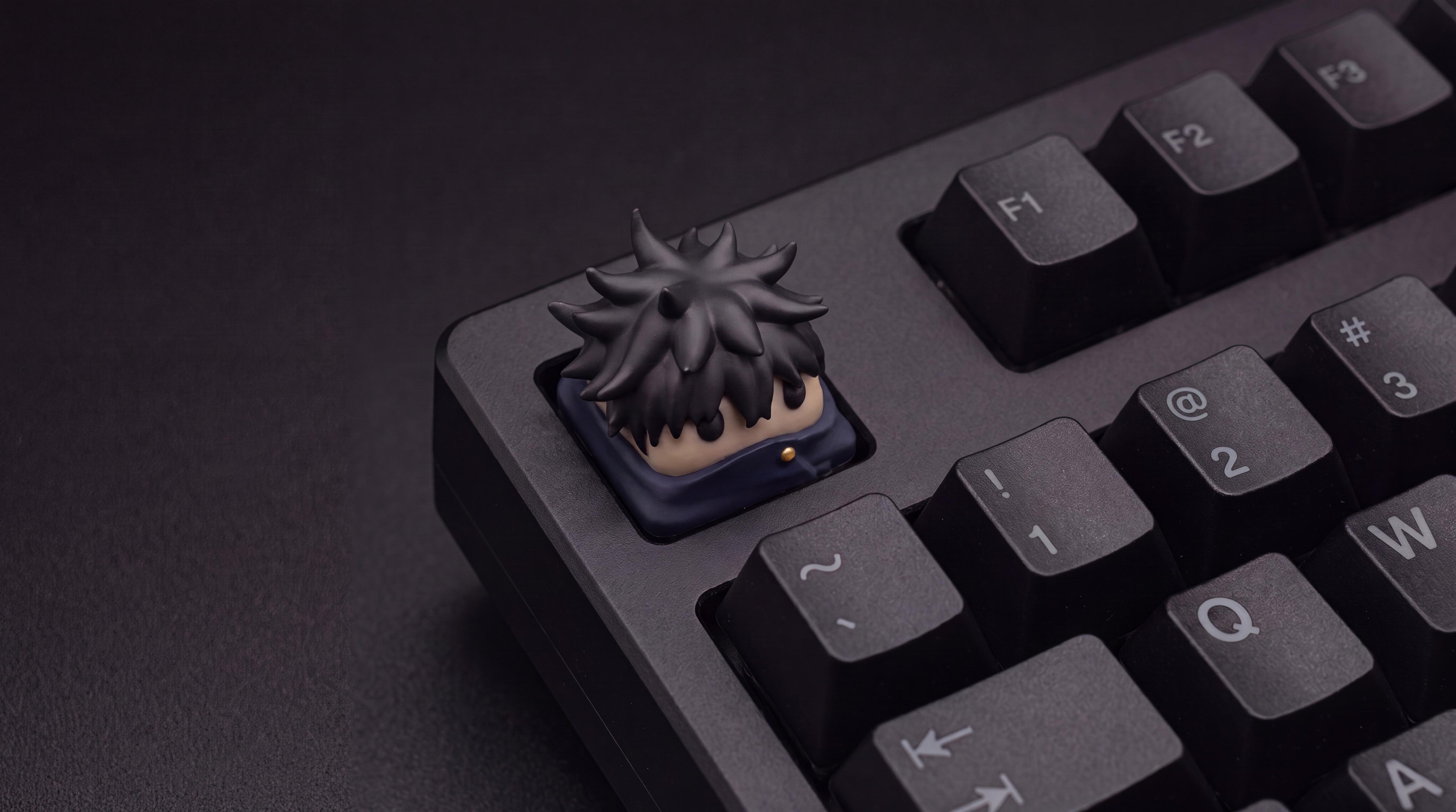 Megumi Fushiguro on black keyboard
