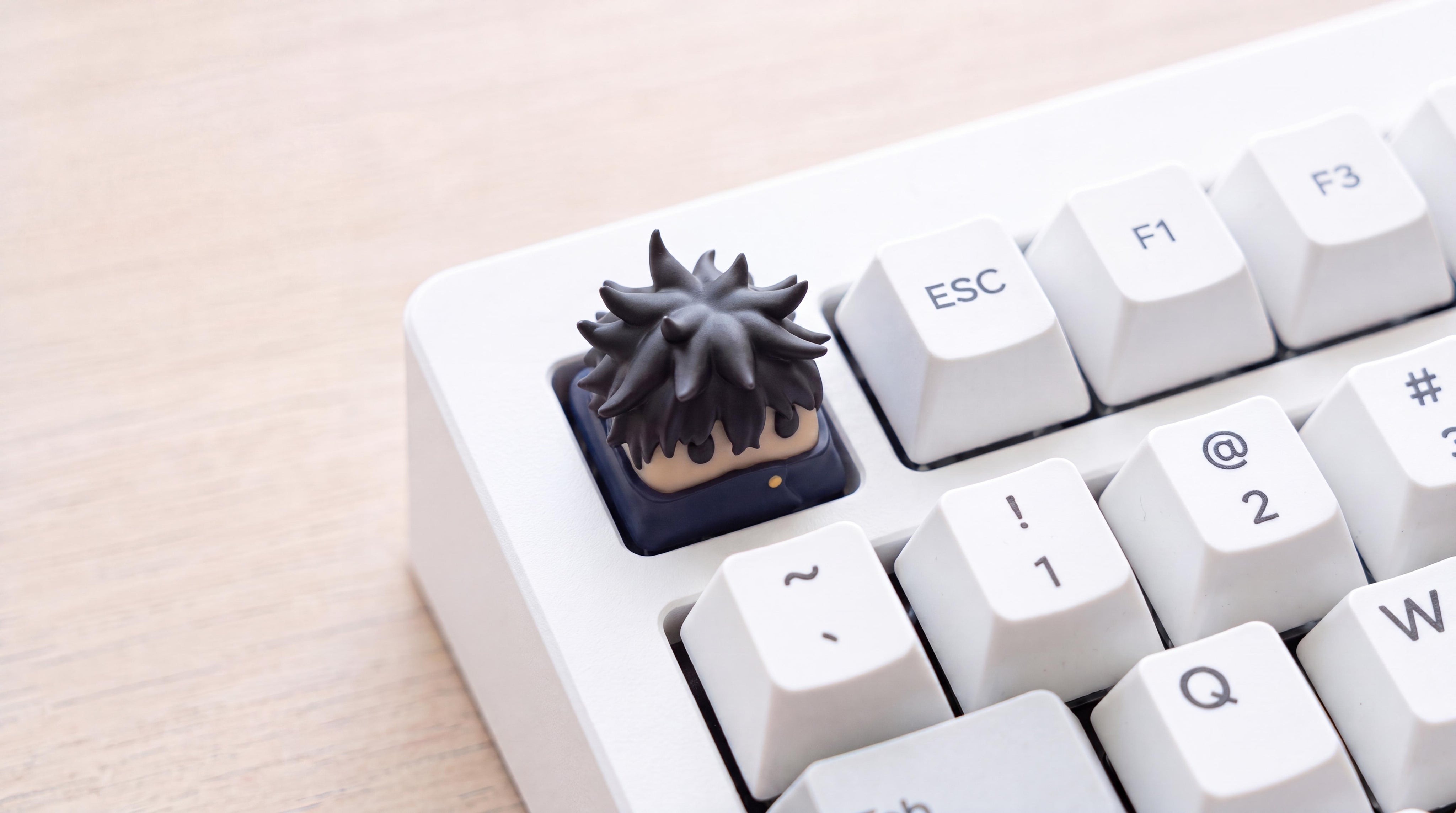Megumi Fushiguro on white keyboard