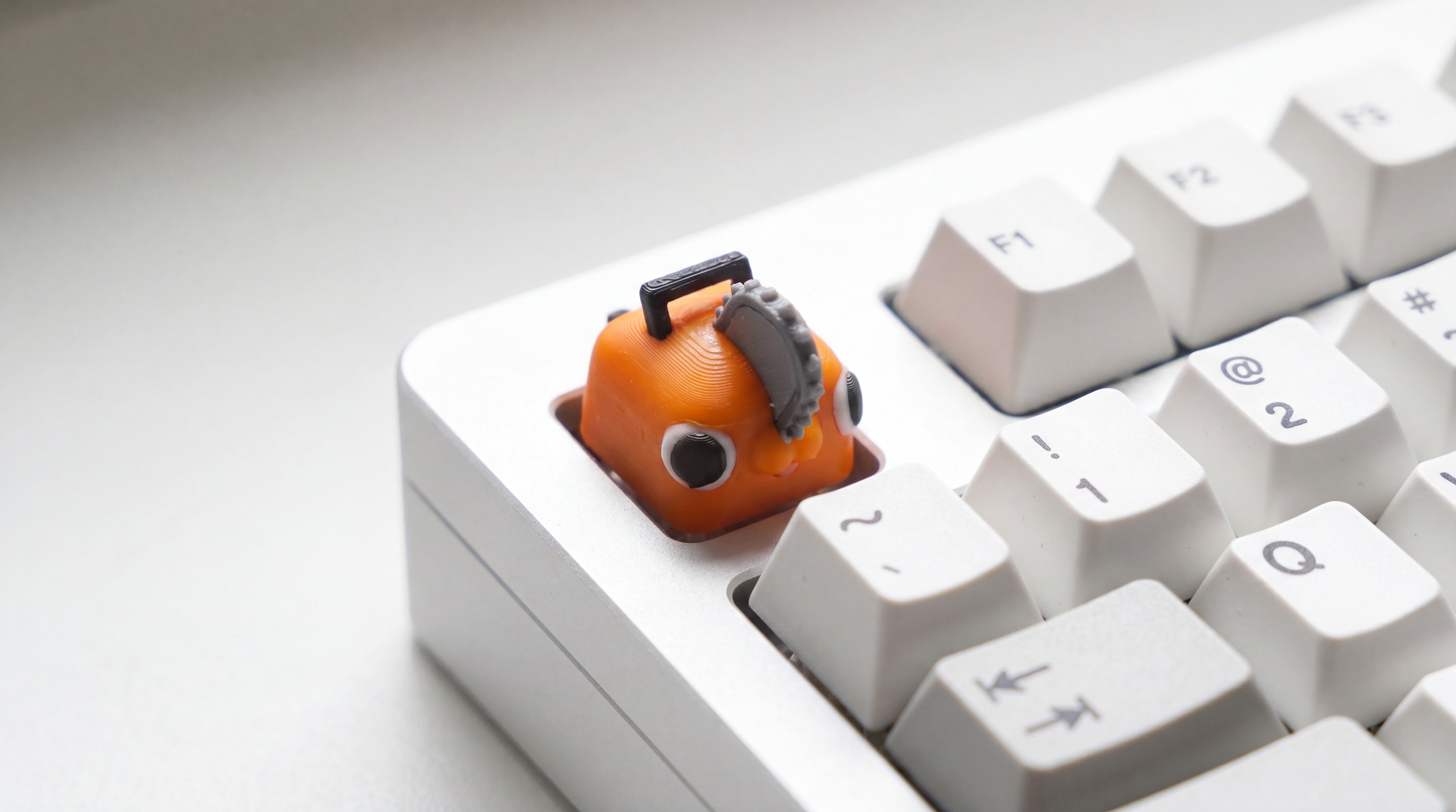 Pochita on white keyboard